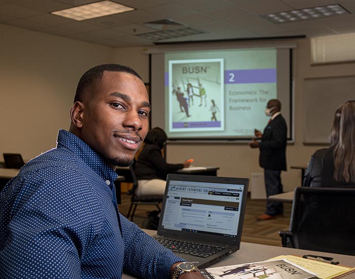 Male student in business management class