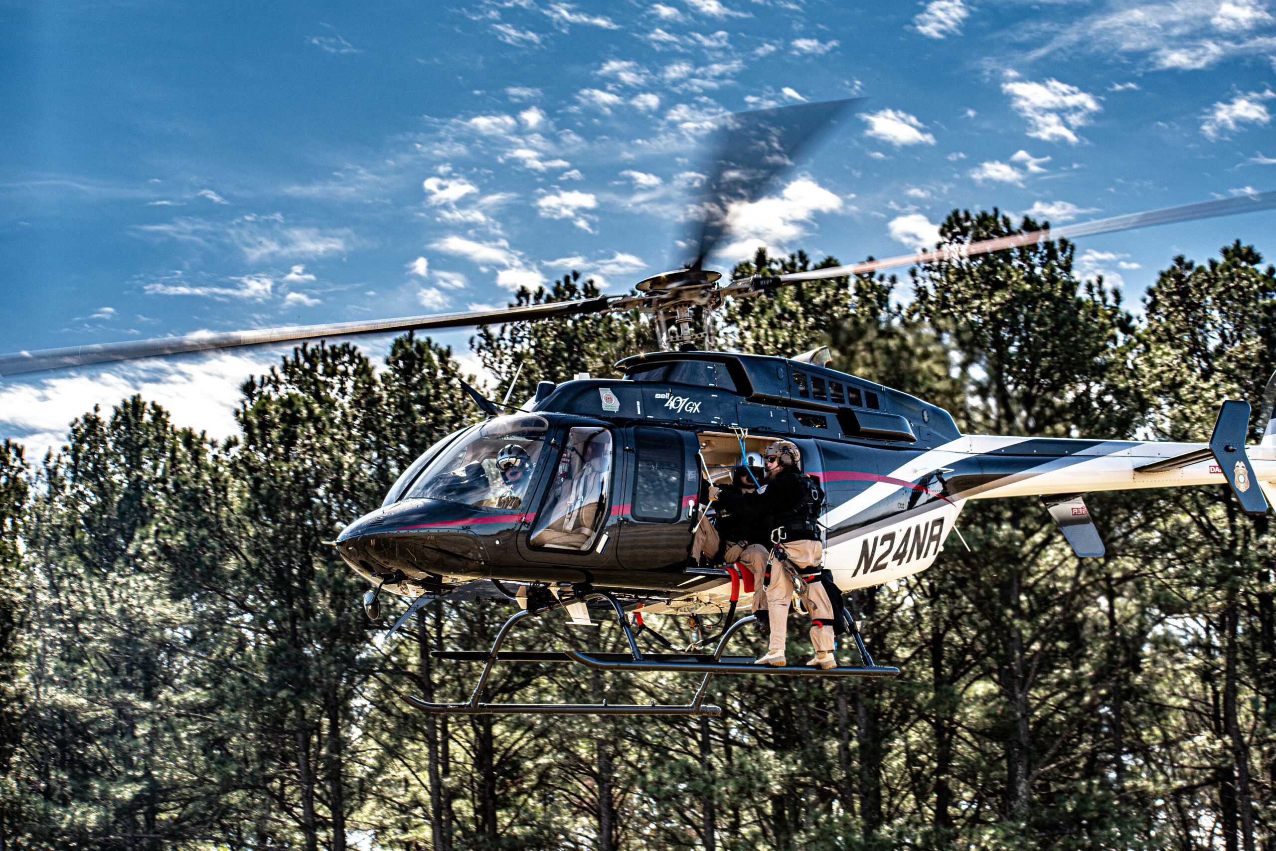 Guys in helicopter in the air