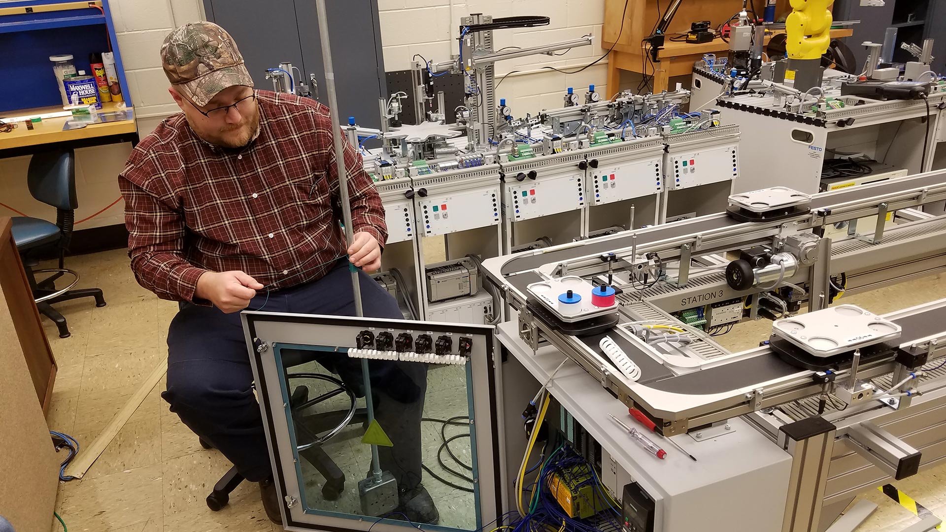 Male student working on engineering technology device