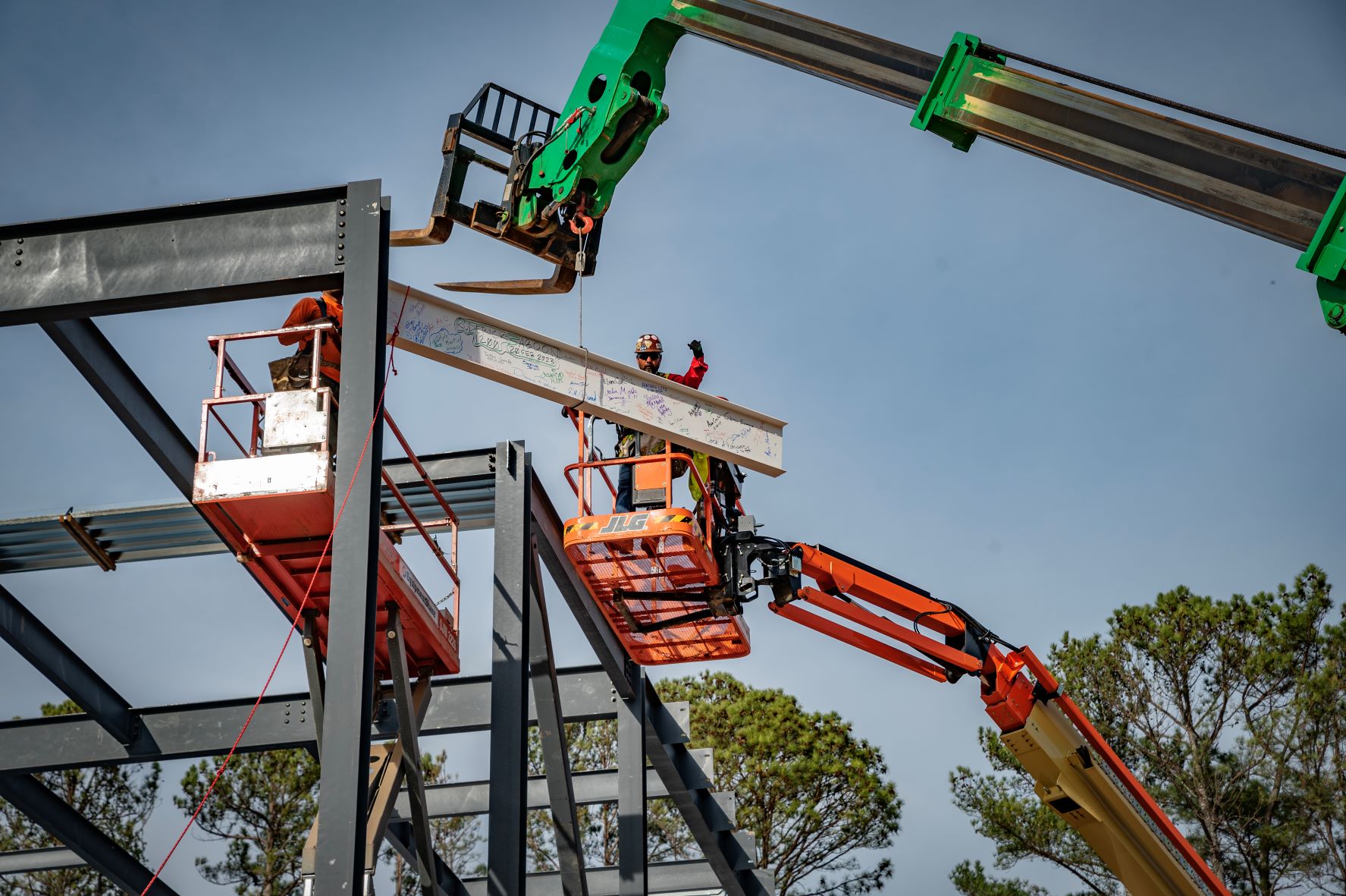 Construction workers put the final beam in place for Athens Technical College's new 43,000-square-foot industrial systems technology building on Monday, Feb. 20, 2023.